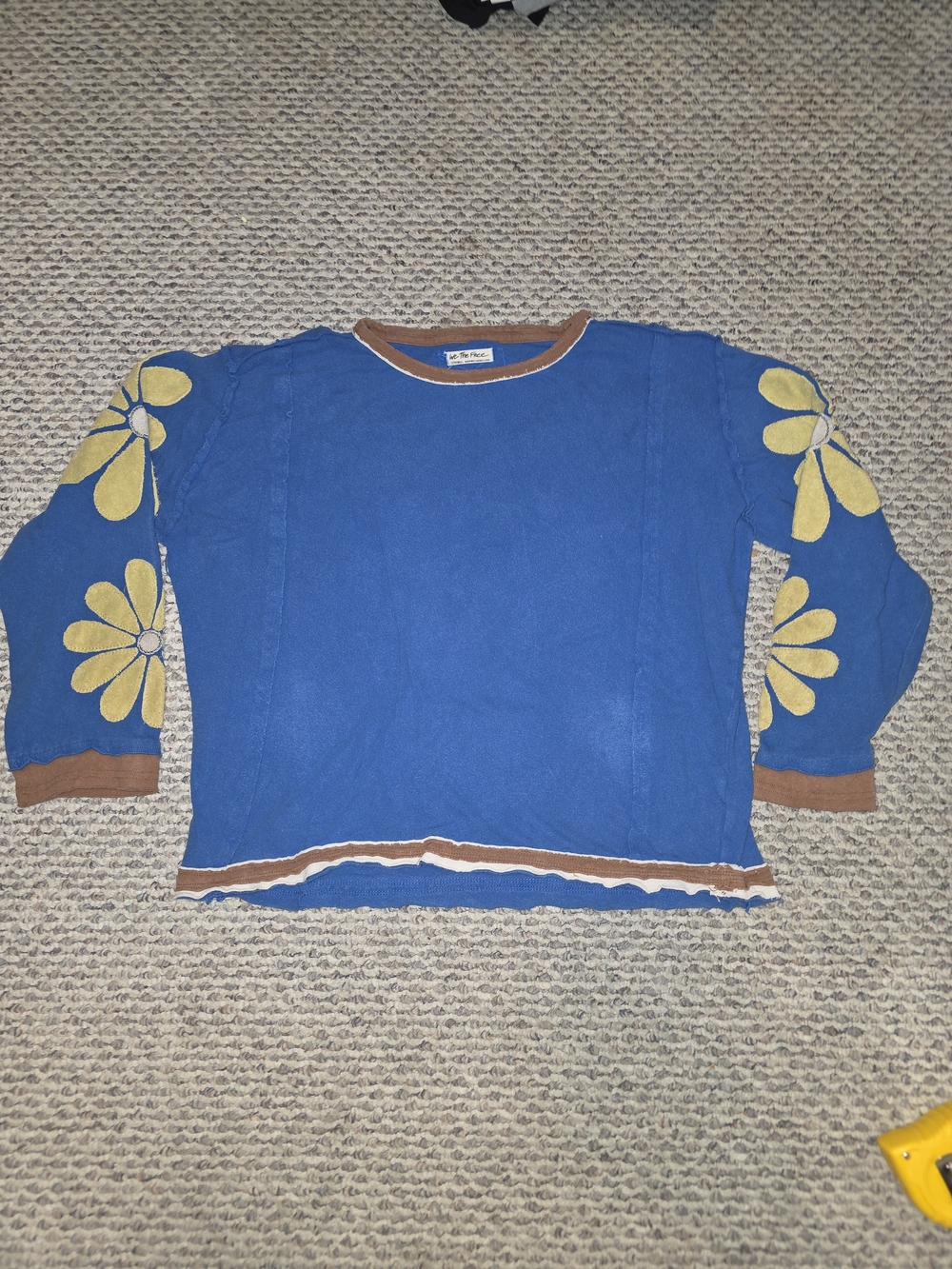 We The Free Blue Crewneck Sweater with Yellow Floral Sleeves and Brown Trim